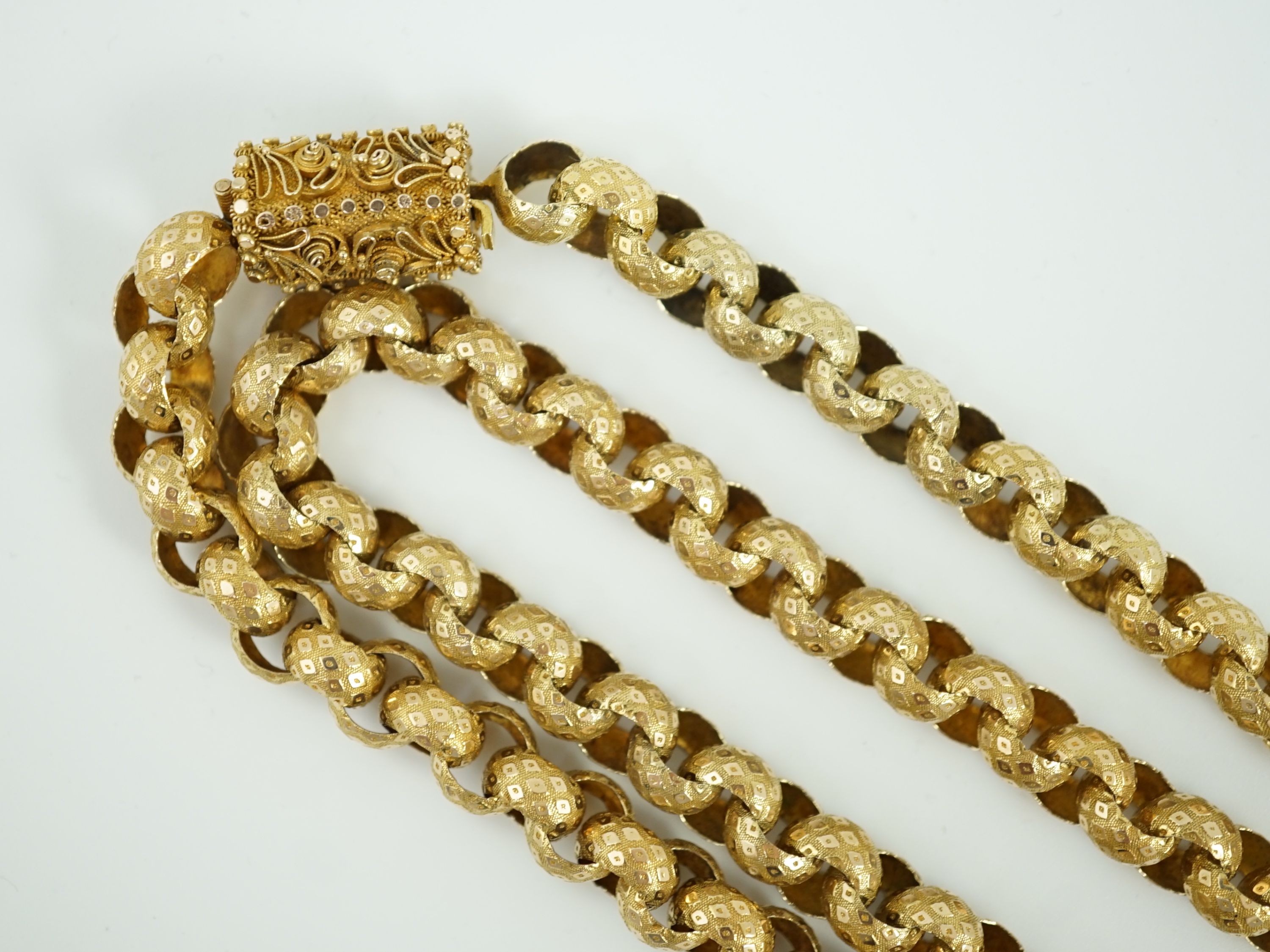 An early 19th century gold muff chain